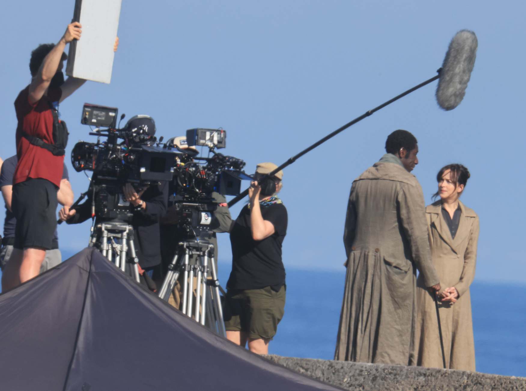 Dakota_Johnson_-_filming__Persuasion__on_The_Cobb_at_Lyme_Regis2C_UK_06152021_02.jpg