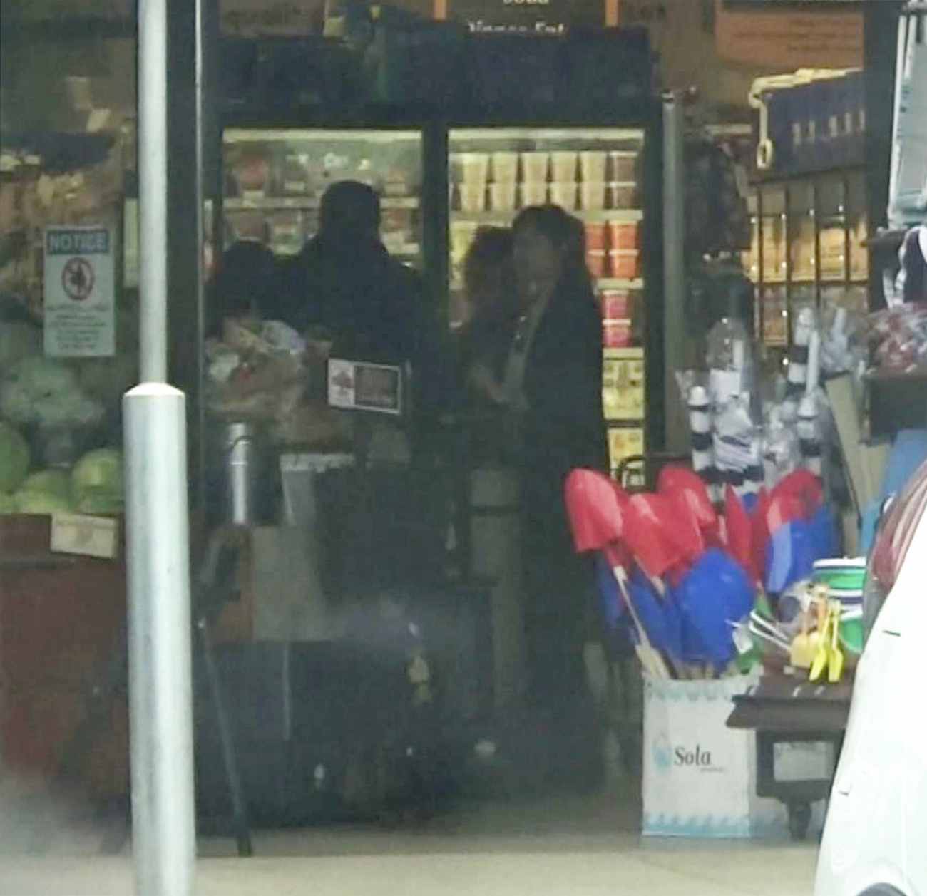 Dakota_Johnson___Chris_Martin_-_Try_to_hide_as_they_pick_up_groceries_together_in_Malibu2C_CA_-_May_2000009.jpg