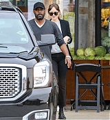 Dakota_Johnson___Chris_Martin_-_Try_to_hide_as_they_pick_up_groceries_together_in_Malibu2C_CA_-_May_2000005.jpg